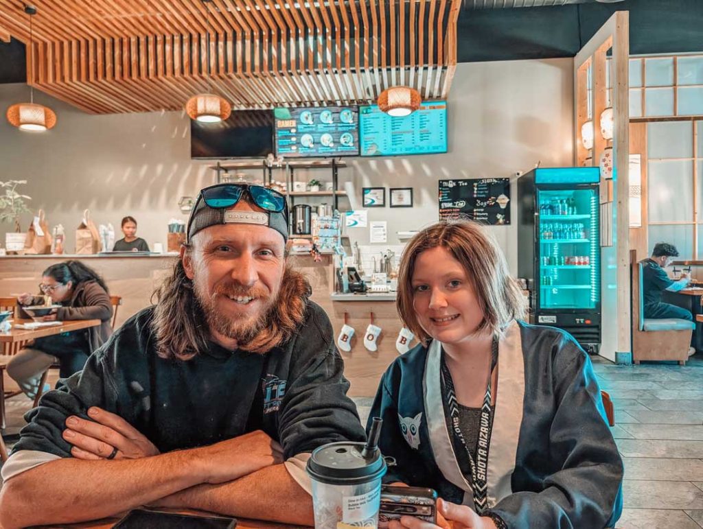 husband and daughter eating Ramen 